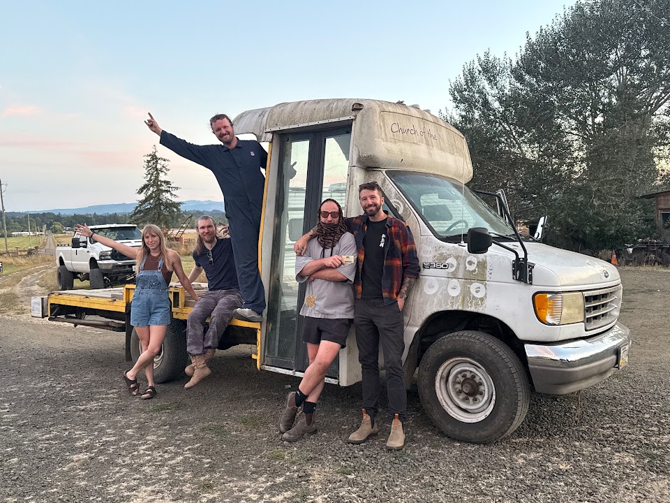 Five members of the crew posing beside Buck