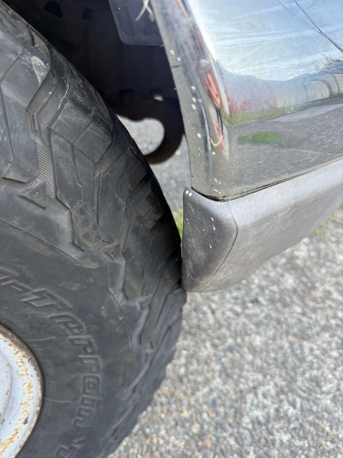 Front tire close to Buck's body and bumper