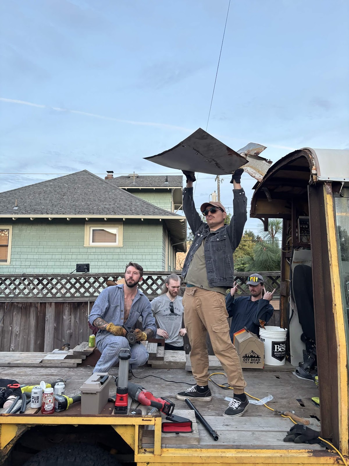 the crew gathered on Buck’s flatbed during work